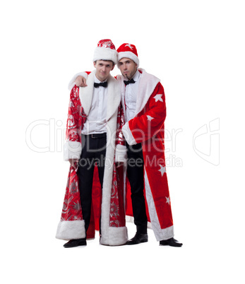 Funny friends posing in coats of Santa Claus
