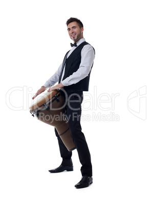 Smiling young drummer posing at camera