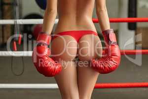 Image of female boxer's elastic ass in thong