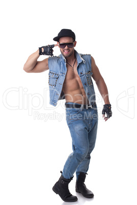 Cheerful muscular male model posing in denim suit