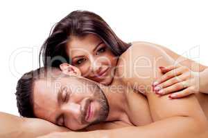 Image of nude lovers smiling dreamily at camera