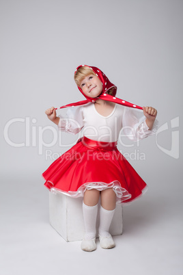 Sweet little ballerina posing in folk costume