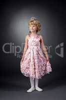 Little dancer posing in pink dress and diadem