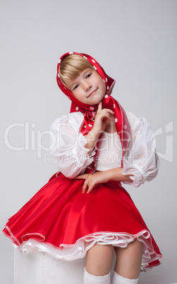Image of smiling blonde girl in folk costume