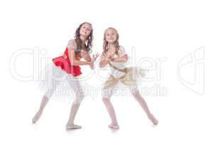 Two adorable ballet dancers, isolated on white
