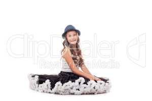 Studio shot of funny young ballerina in hat