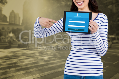 Composite image of mid section of woman pointing at tablet compu