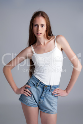 Image of beautiful skinny model on gray backdrop