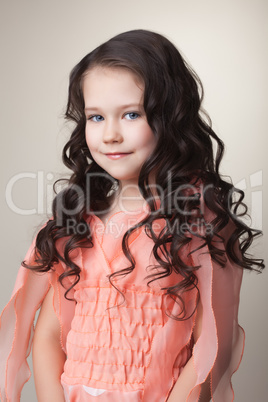 Pretty little brunette in coral dress