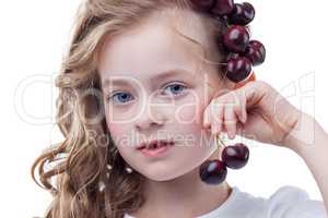 Portrait of lovely freckled girl with cherries