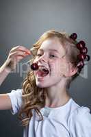 Image of cute little girl wants to taste cherry