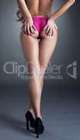 Close-up of leggy model in fuchsia panties