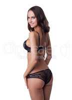 Curvy tanned girl in black erotic lingerie