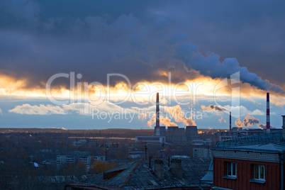 Power plant seen above residential blocks of city