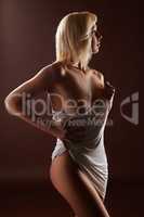 Exciting platinum blonde posing baring breast