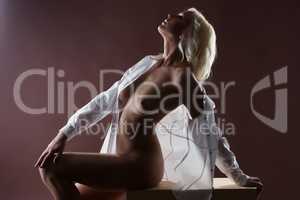 Passionate platinum blonde posing naked in studio