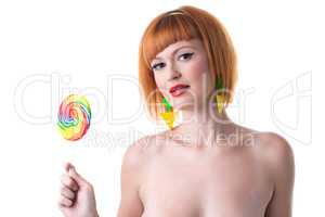 Sexy pin-up girl posing with lollipop
