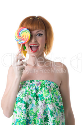 Funny pin-up girl posing with delicious candy
