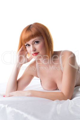 Image of red-haired woman lying in studio Image of red-haired woman lying in studio
