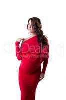 Pensive pregnant woman dressed in elegant dress