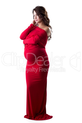 Beautiful expectant mother posing in elegant dress