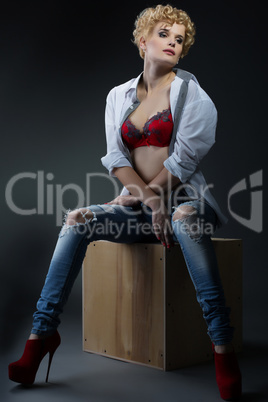 Model with short hair posing in casual clothes