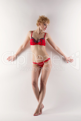 Image of blond woman posing in red underwear