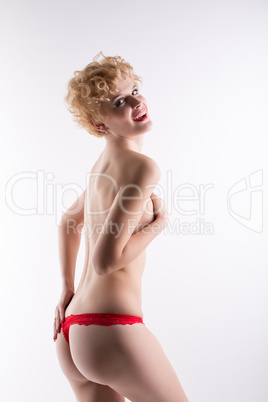 Cheerful blonde woman posing in red panties