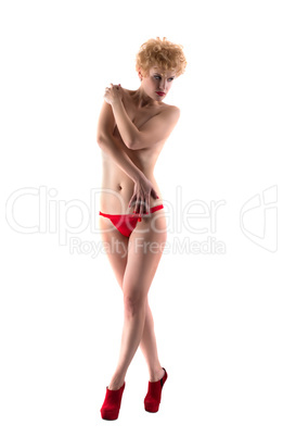 Topless blonde posing covering herself with hands