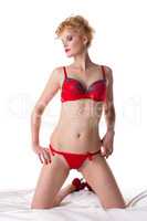 Haughty blonde posing in red underwear