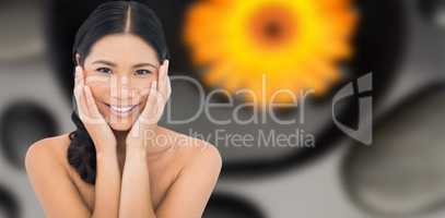Composite image of smiling sensual dark haired model touching he