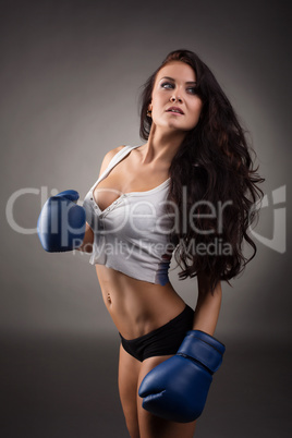 Studio shot of sexy female boxer