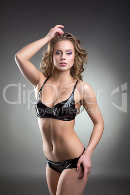 Sexy model posing in latex lingerie