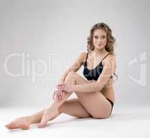 Charming young female athlete posing in studio