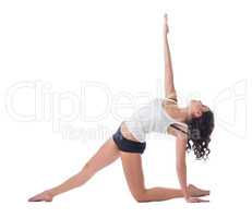 Beautiful curly-haired woman exercising pilates
