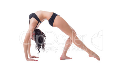 Flexible slim woman doing pilates exercise