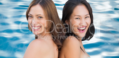 Composite image of laughing beautiful nude models posing back-to