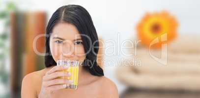 Composite image of sensual nude model drinking orange juice