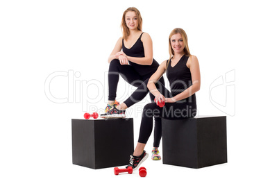 Cute girlfriends-athletes posing at camera