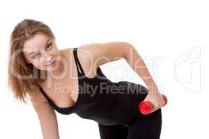 Portrait of cute young girl with dumbbells