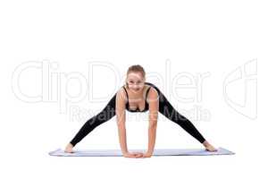 Cute fitness girl stretching before doing exercise