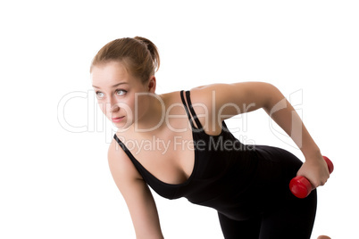 Portrait of sporty girl trains with dumbbells