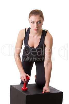 Confident female athlete posing looking at camera