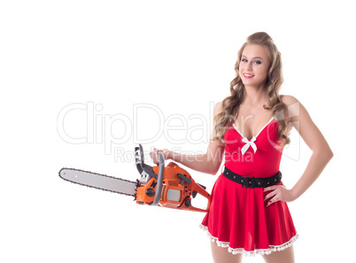 Smiling girl dressed as Santa posing with chainsaw