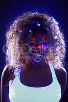 Portrait of pretty girl with candy in neon light
