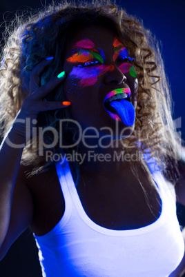 Image of funny girl posing at camera in UV light