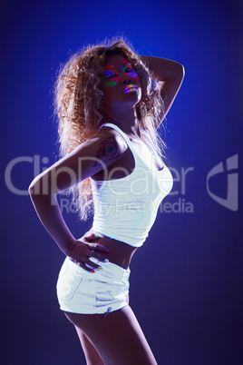 Spectacular slim girl posing in ultraviolet