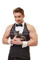 Handsome muscular male dancer posing with kitten