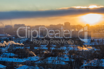 Top view of industrial city at sunset