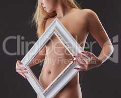 Studio shot of beautiful nude girl posing framed